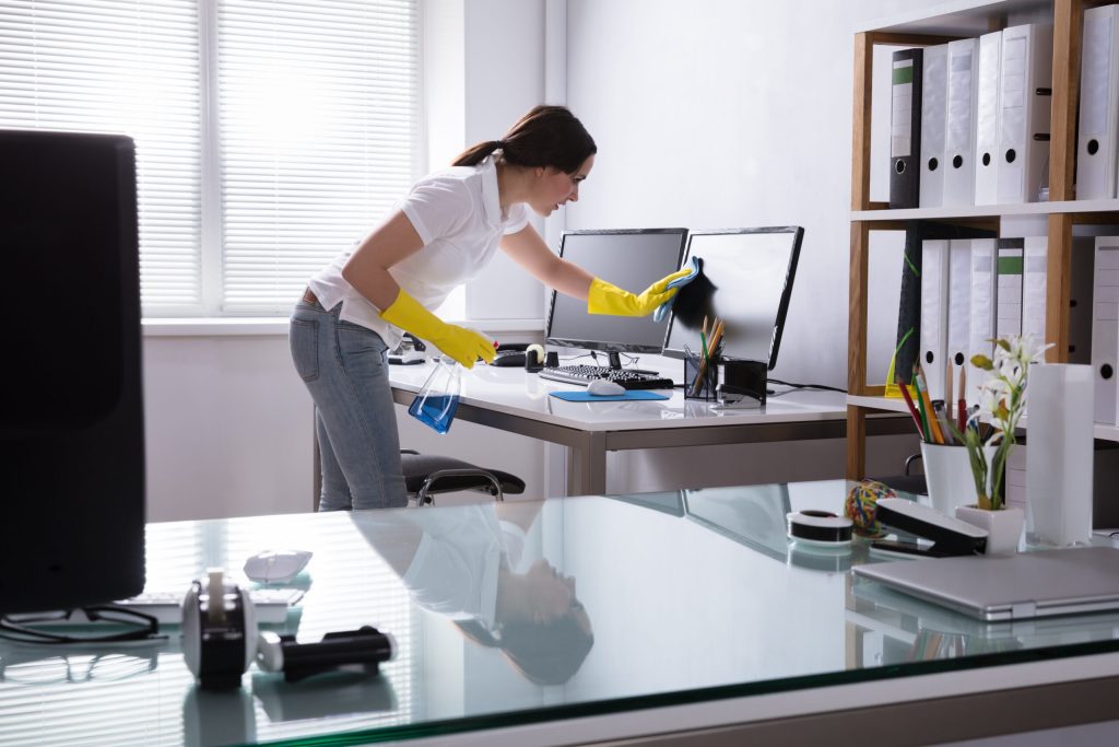 Woman Cleaning Computer In Office with Kulchem Chemicals